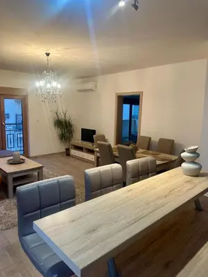 a dining room with a large table and chairs at The Coastal Charm in Pržno