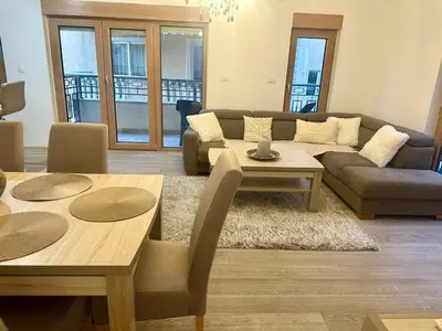 a living room with a couch and a table at The Coastal Charm in Pržno