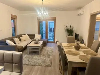 a living room with a couch and a table at The Coastal Charm in Pržno
