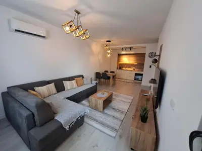 a living room with a couch and a table at Violin Apartment in Ulcinj