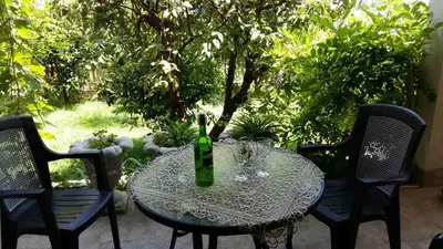 a table with a bottle of wine and glasses on it at Glorious in Kotor