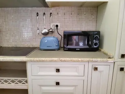 a microwave sitting on top of a kitchen counter at Glorious in Kotor