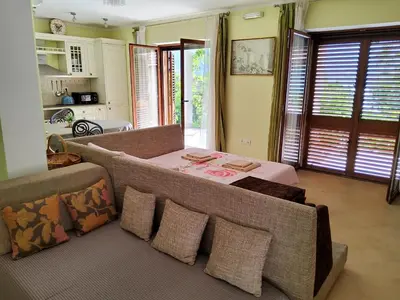 a living room with a couch and a table at Glorious in Kotor