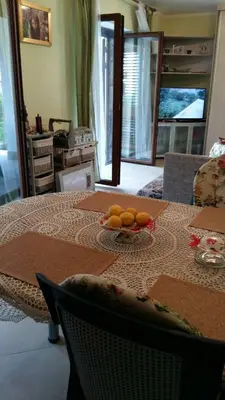 a table with a bowl of oranges on it at Glorious in Kotor