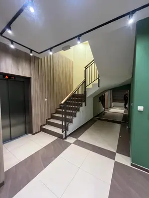 a hallway with a staircase in a building at Dora apartment with terrace and parking in Podgorica