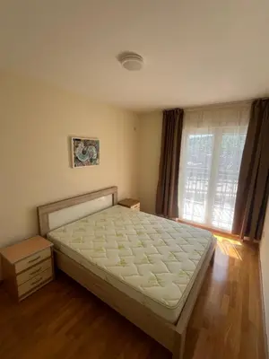 a bedroom with a bed and a window at Dora apartment with terrace and parking in Podgorica