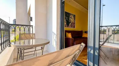 a balcony with a table and a couch at Harmony Apartment 2 in Bar