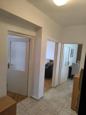 an empty room with a door and a room with a bedroom at TriKula Nest in Bar