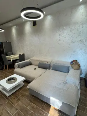 a living room with a couch and a table at Apartman Itana Budva in Budva