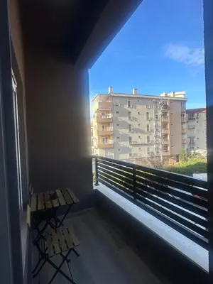 a balcony with a table and a view of a building at Modern Apartments Two Pearls in Budva