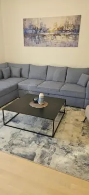 a living room with a couch and a coffee table at ROYAL Residences in Cetinje