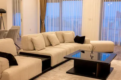 a living room with a couch and a coffee table at sea and sun luxury apartment in Ulcinj