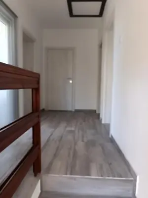 an empty room with white walls and a wooden floor at Infinite Sunset in Ulcinj