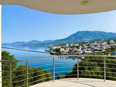 a view from the balcony of a house overlooking the water at Hladna Uvala Minimalist 2 Bedroom Apartman in Bar