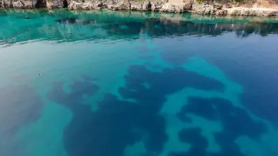 an aerial view of a body of blue water at Hladna Uvala Minimalist 2 Bedroom Apartman in Bar