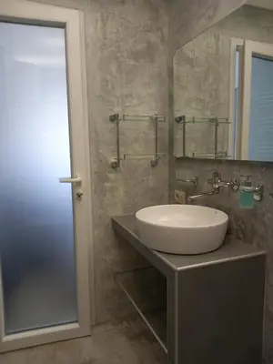 a bathroom with a sink and a mirror at Markovići Studio