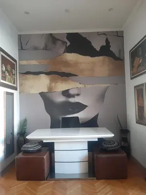 a room with a white desk and a painting on the wall at Stylish Charm Downtown in Podgorica