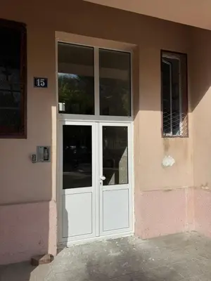 a white door on a building with at Stylish Charm Downtown in Podgorica
