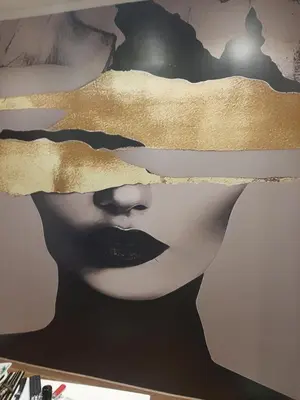 a poster of a woman with her face at Stylish Charm Downtown in Podgorica