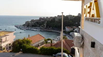a view of a harbor with boats in the water at Dea Apartments in Ulcinj
