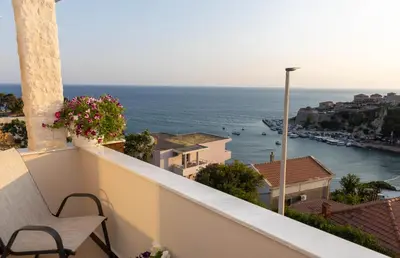 a balcony with a view of the ocean at Dea Apartments in Ulcinj