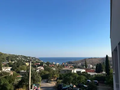 a view of a city with the ocean in the background at Stan Bijela Kuca in Sutomore