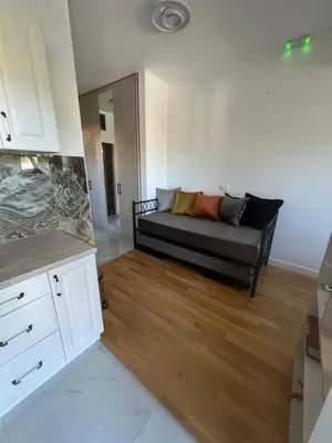 a living room with a couch in a room at SunnyBar in Bar