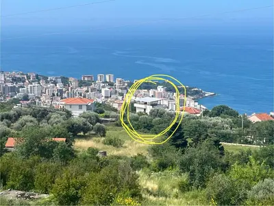 a city with a yellow circle on top of a field at Dobre Voda Montenegro in Dobra Voda