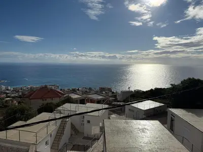 a view of the ocean from a city at Dobre Voda Montenegro in Dobra Voda