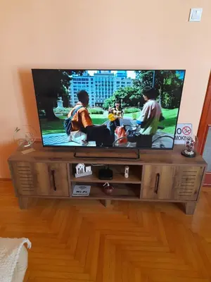 a flat screen tv sitting on a entertainment center at Apartman Mina in Podgorica