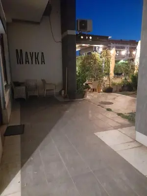 a building with a sign on the side of it at Apartman Mina in Podgorica