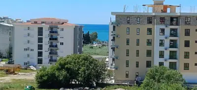 an aerial view of two buildings and the ocean at KalamperovicApartmani in Bar