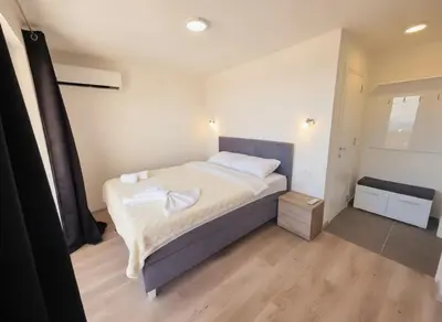 a bedroom with a bed with white towels on it at Villa Luca in Krimovice