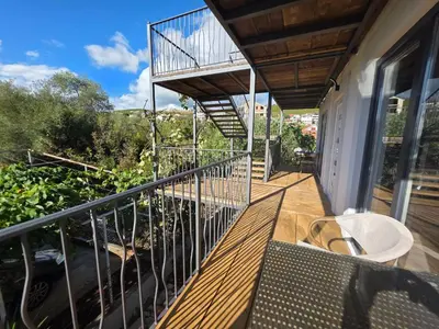 a balcony of a house with a staircase on it at Villa Luca in Krimovice