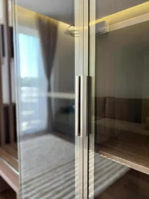 a glass door of a refrigerator in a room at Kurti Apartments in Ulcinj
