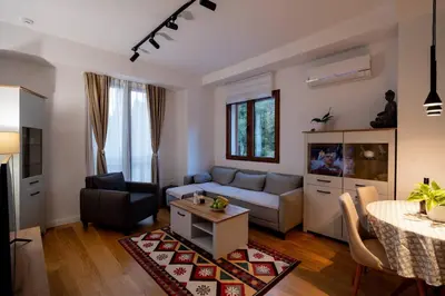 a living room with a couch and a table at Gorica Apartment in Podgorica