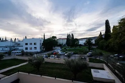 a view of a city with cars parked in a parking lot at Gorica Apartment in Podgorica