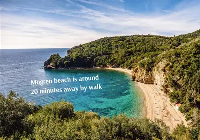 a beach with the words morgan beach is around minutes away by walk at Apartment Golub in Budva