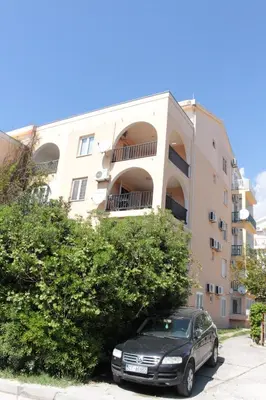 a car parked in front of a building at Apartment Golub in Budva
