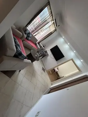 an overhead view of a living room with a couch and a window at Sun & Sea Terrace Apartment in Becici