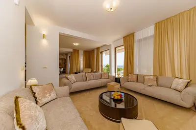 a living room with two couches and a table at Villa Stella in Bar