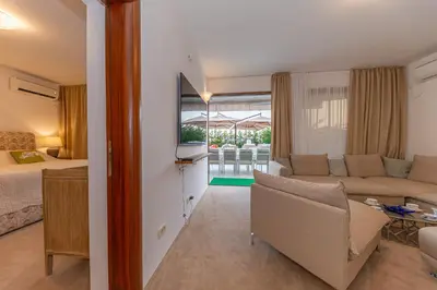 a living room with a couch and a bed at Villa Stella in Bar
