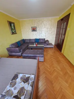 a living room with a couch and a table at Sunrise 2 in Podgorica