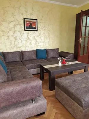 a living room with a couch and a coffee table at Sunrise 2 in Podgorica