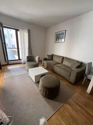 a living room with a couch and a coffee table at Natali 1 in Budva