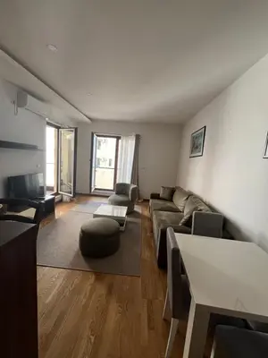 a living room with a couch and a table at Natali 1 in Budva