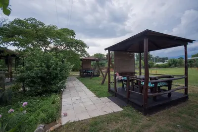 a wooden gazebo in a yard with at Greenfield campsite in Donji Štoj