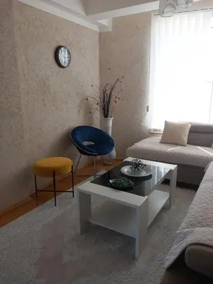 a living room with a couch and a table at APARTMENTS ANI Ester in Ulcinj
