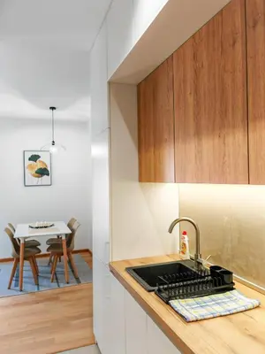 a kitchen with a sink and a counter top at Modern City Apartment Budva-Central Location,5 min to Beach in Budva