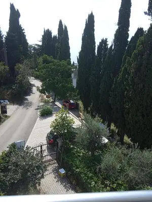 a view of a street with cars parked in a park at Wonderful Seaview Apartment in Ulcinj